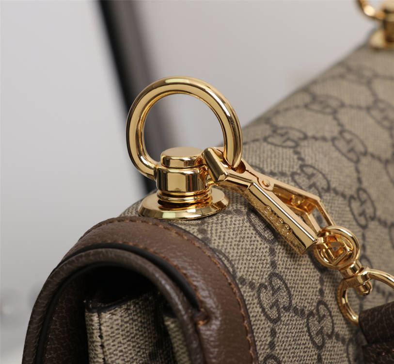 Crossbody bag with round logo in gold color