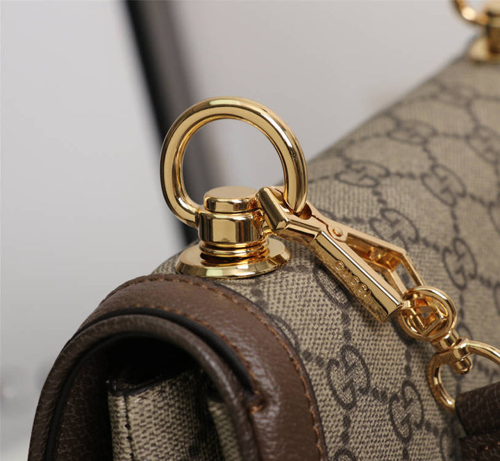 Crossbody bag with round logo in gold color