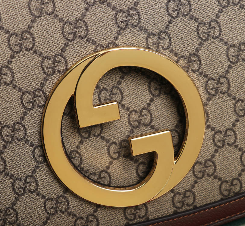 Crossbody bag with round logo in gold color