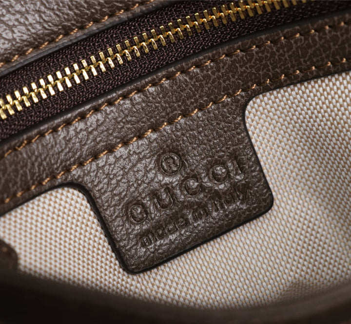 Crossbody bag with round logo in gold color