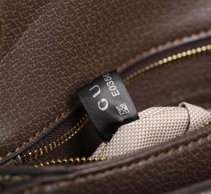 Crossbody bag with round logo in gold color