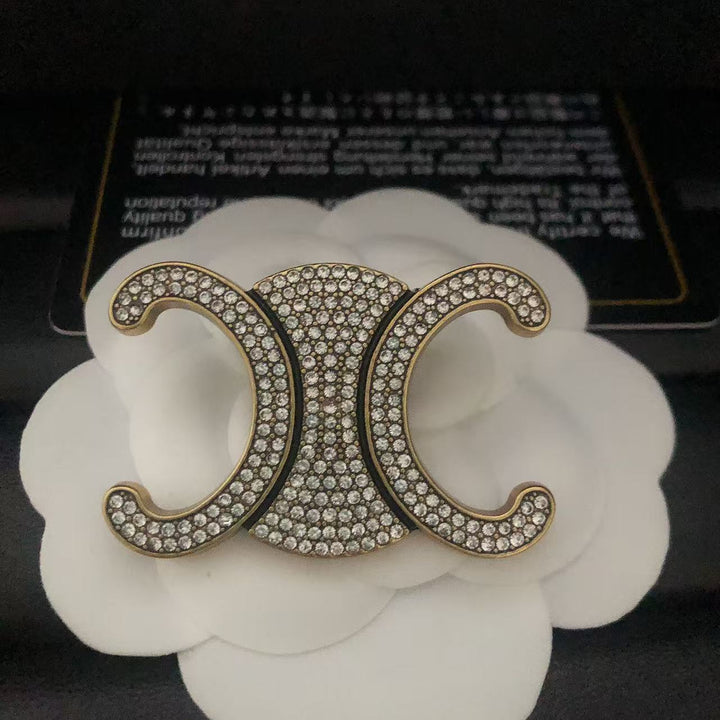 Exclusive Logo Rhinestone Brooch