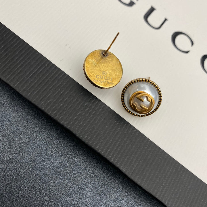 Pearl and brass earrings