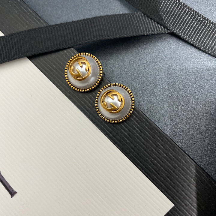 Pearl and brass earrings