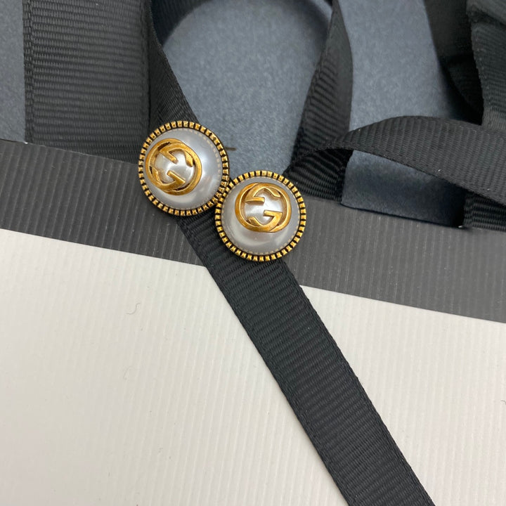 Pearl and brass earrings