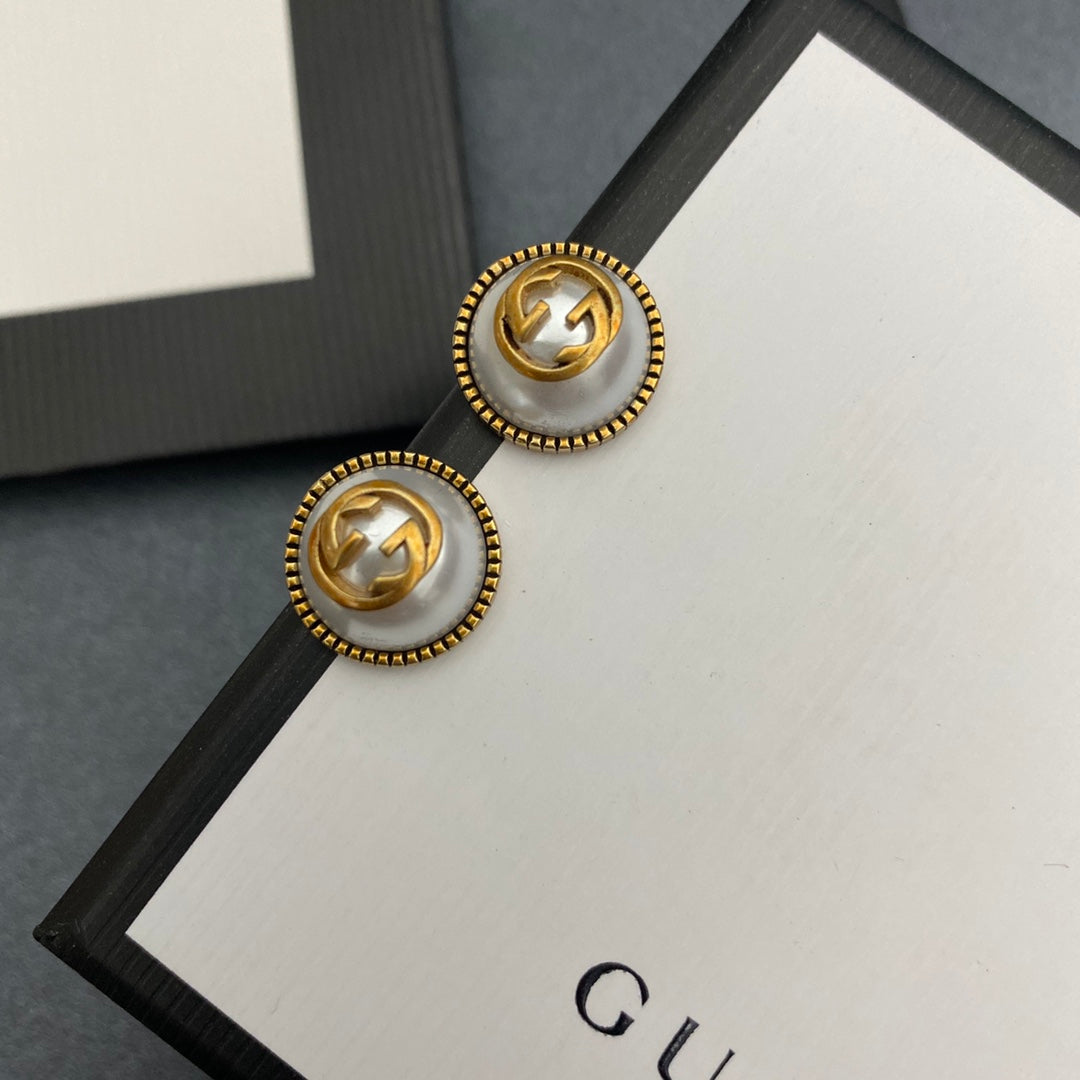 Pearl and brass earrings
