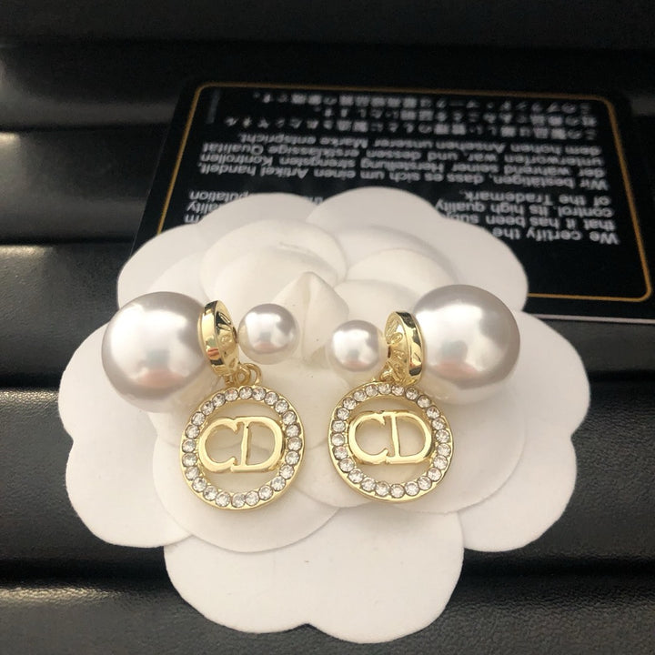 Pearl and rhinestone earrings