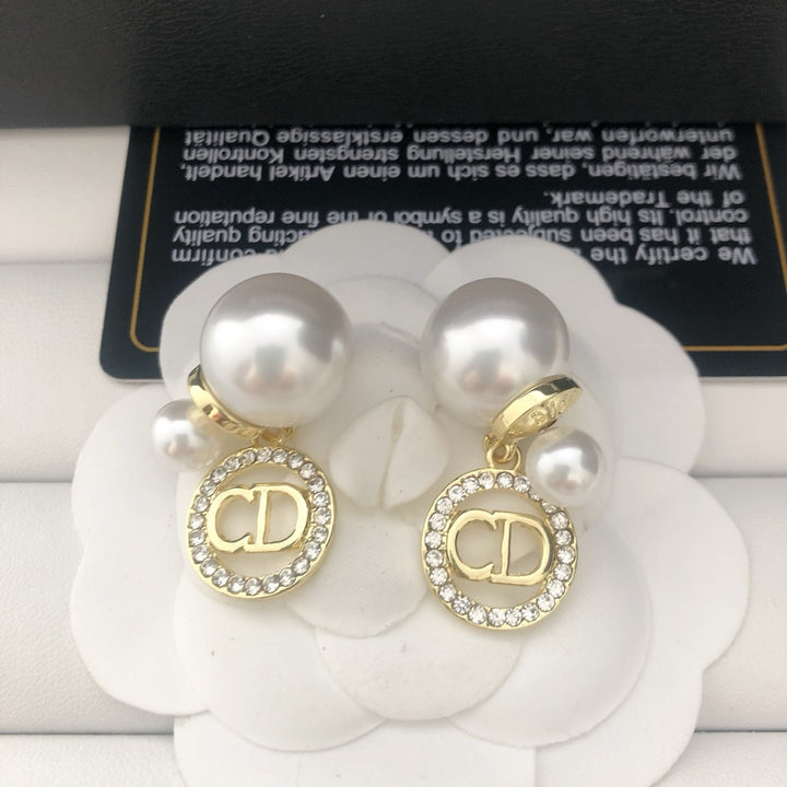 Pearl and rhinestone earrings
