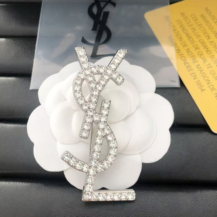 Single row diamond brooch