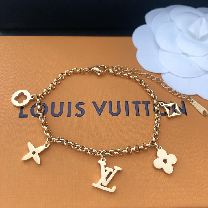 Emblematic Gold Charm Bangle