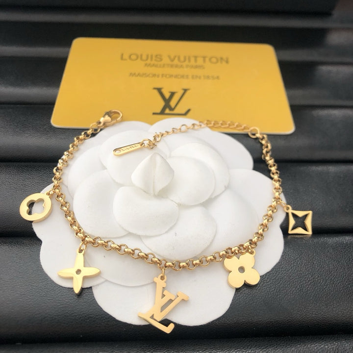 Emblematic Gold Charm Bangle