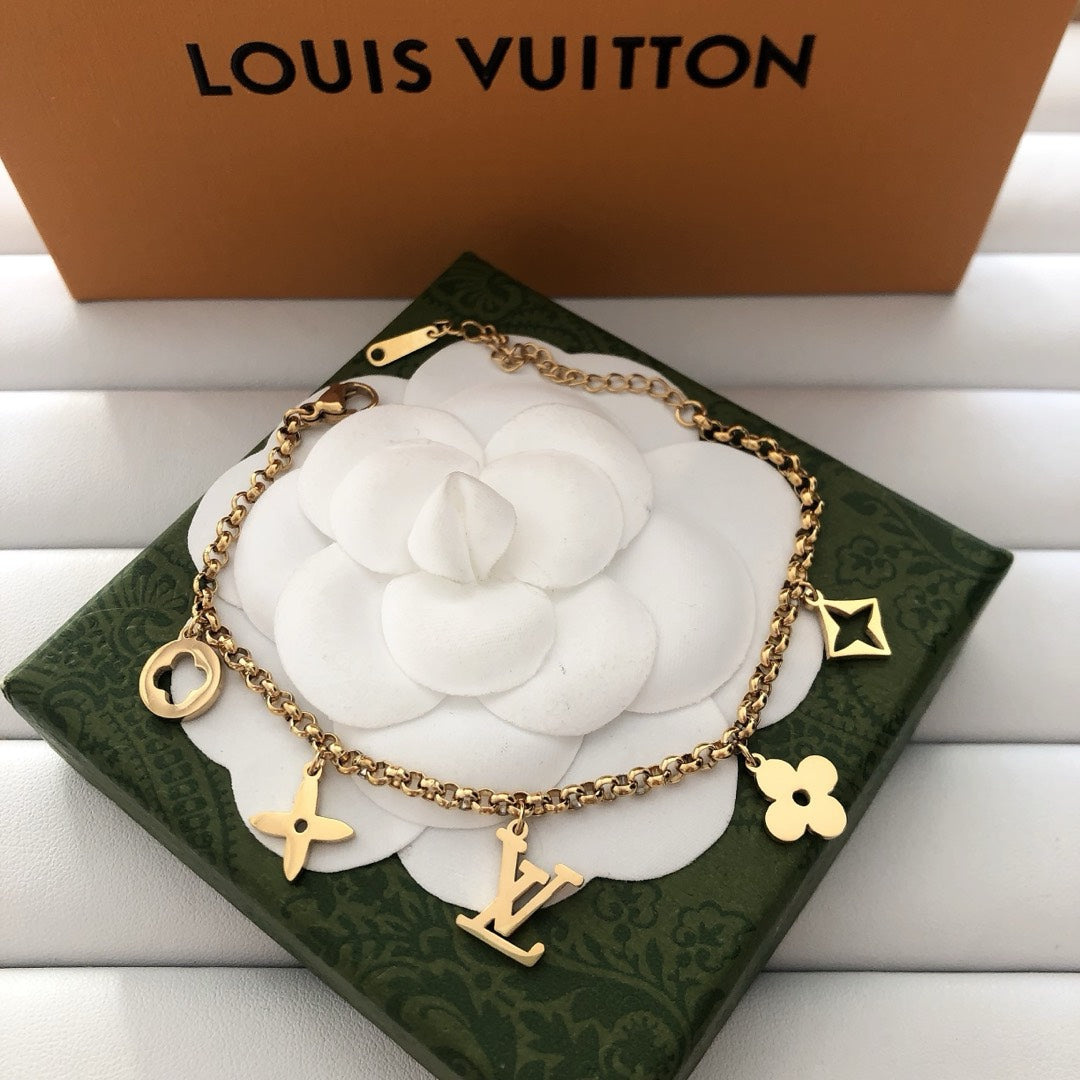 Emblematic Gold Charm Bangle