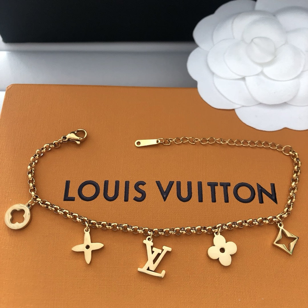 Emblematic Gold Charm Bangle
