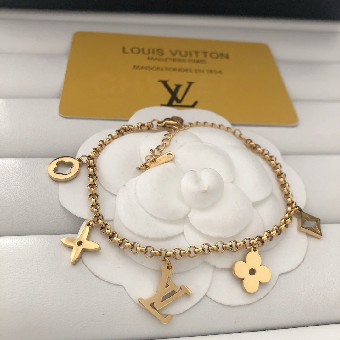 Emblematic Gold Charm Bangle