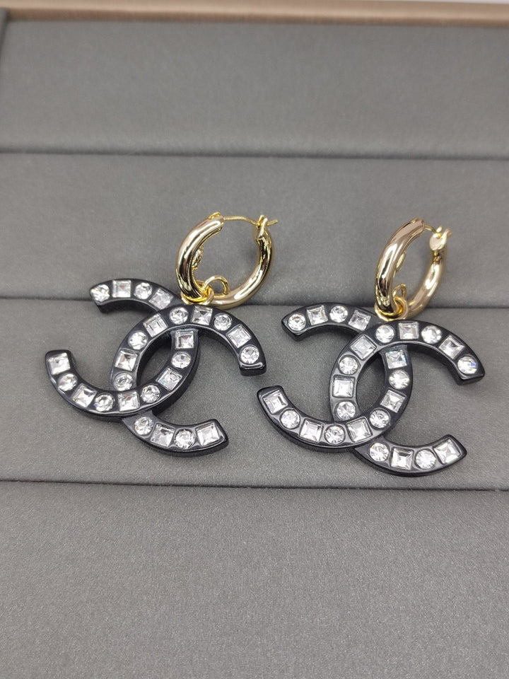 Fashion CC diamond encrusted black acrylic earrings