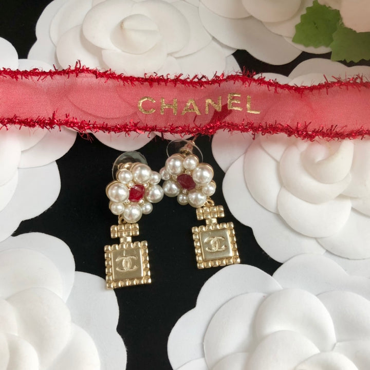 perfume bottle pearl earrings