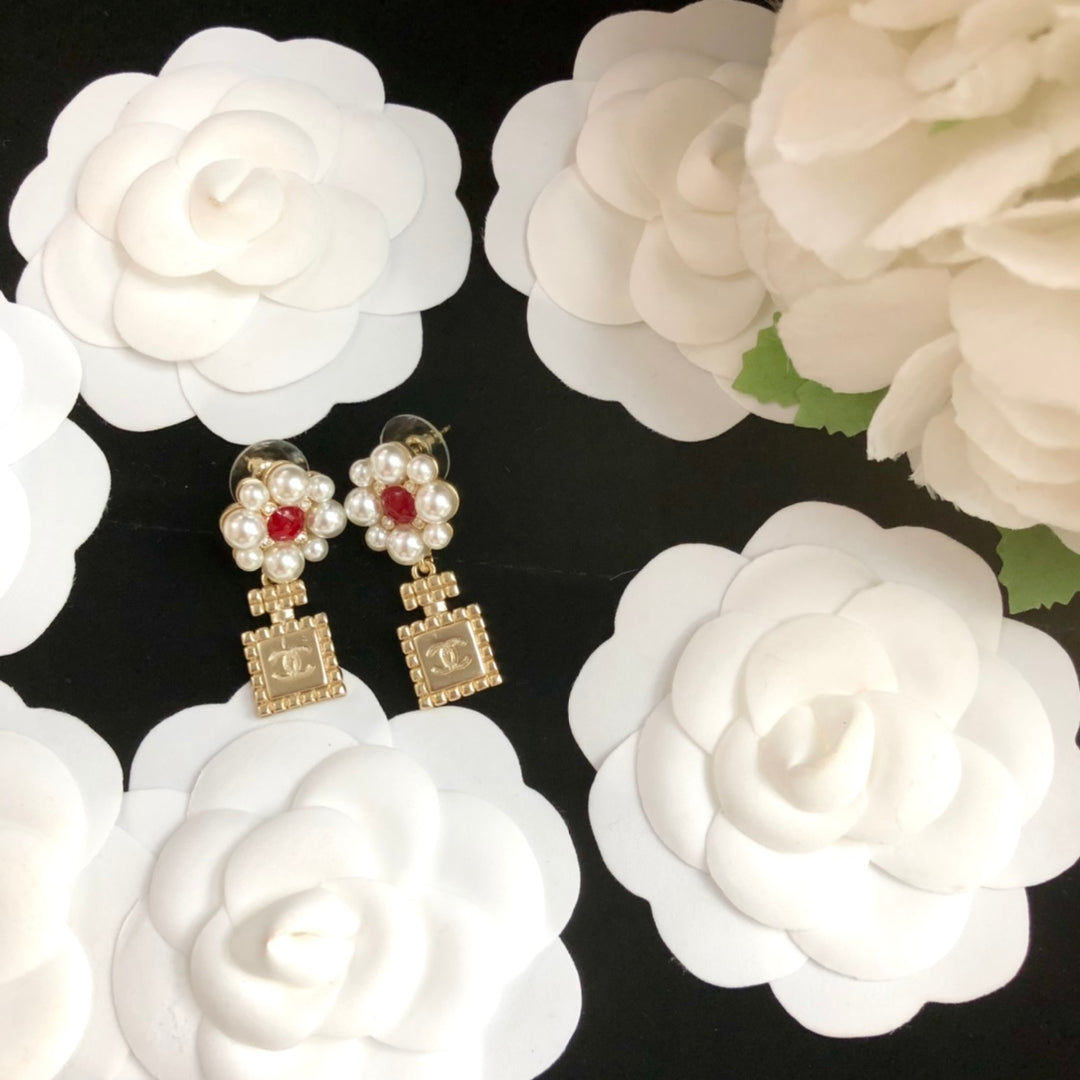 perfume bottle pearl earrings