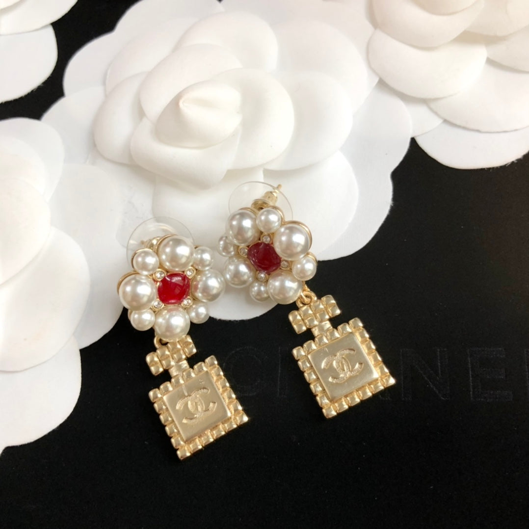 perfume bottle pearl earrings