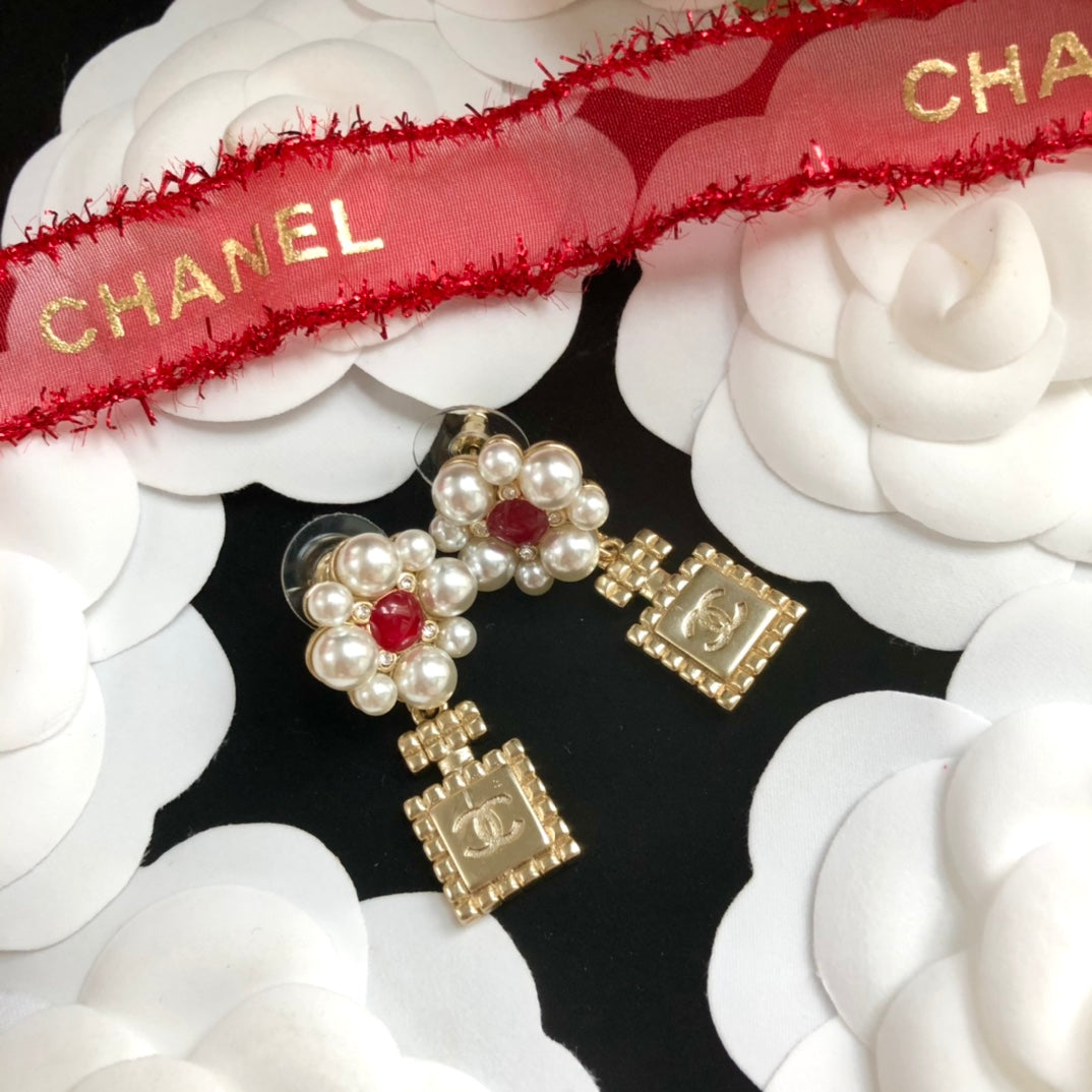 perfume bottle pearl earrings