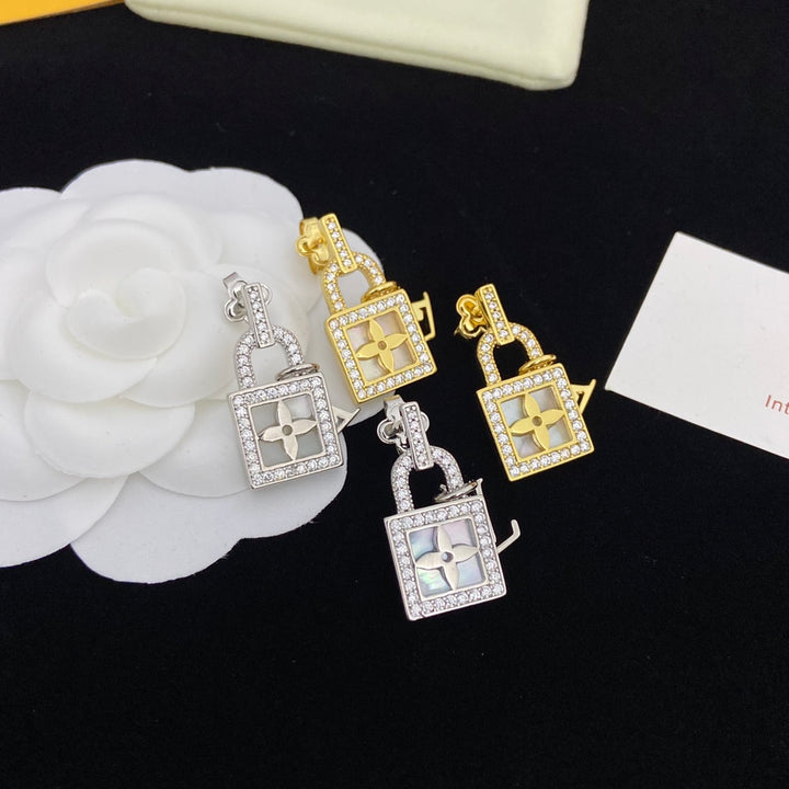 two-tone rhinestone lock earrings