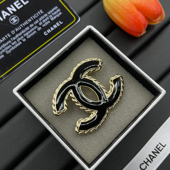 Black Enamel Brooch with Gold Setting