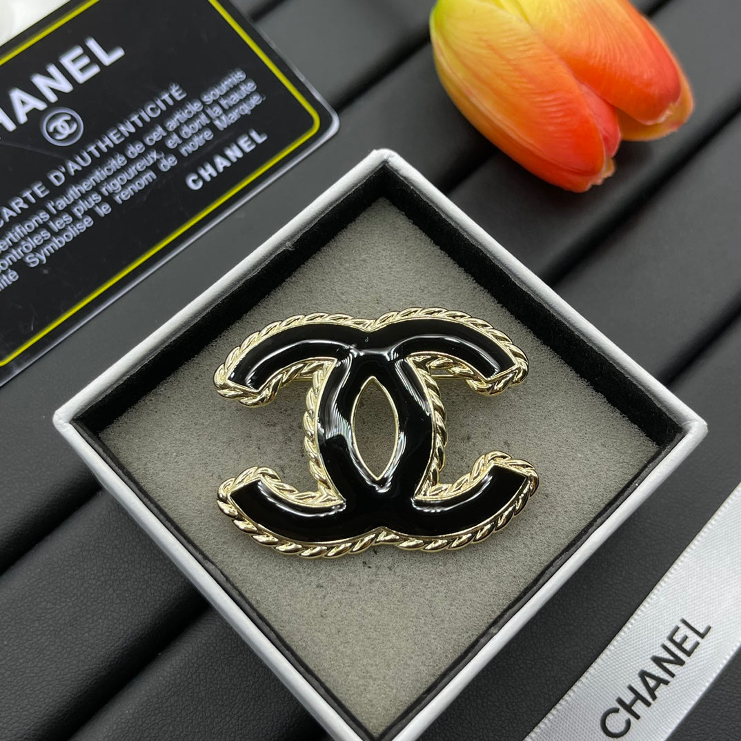 Black Enamel Brooch with Gold Setting