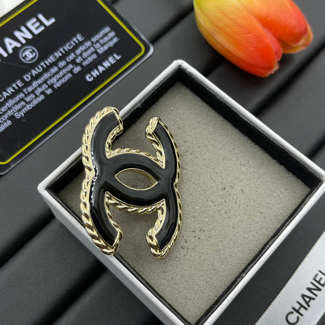 Black Enamel Brooch with Gold Setting