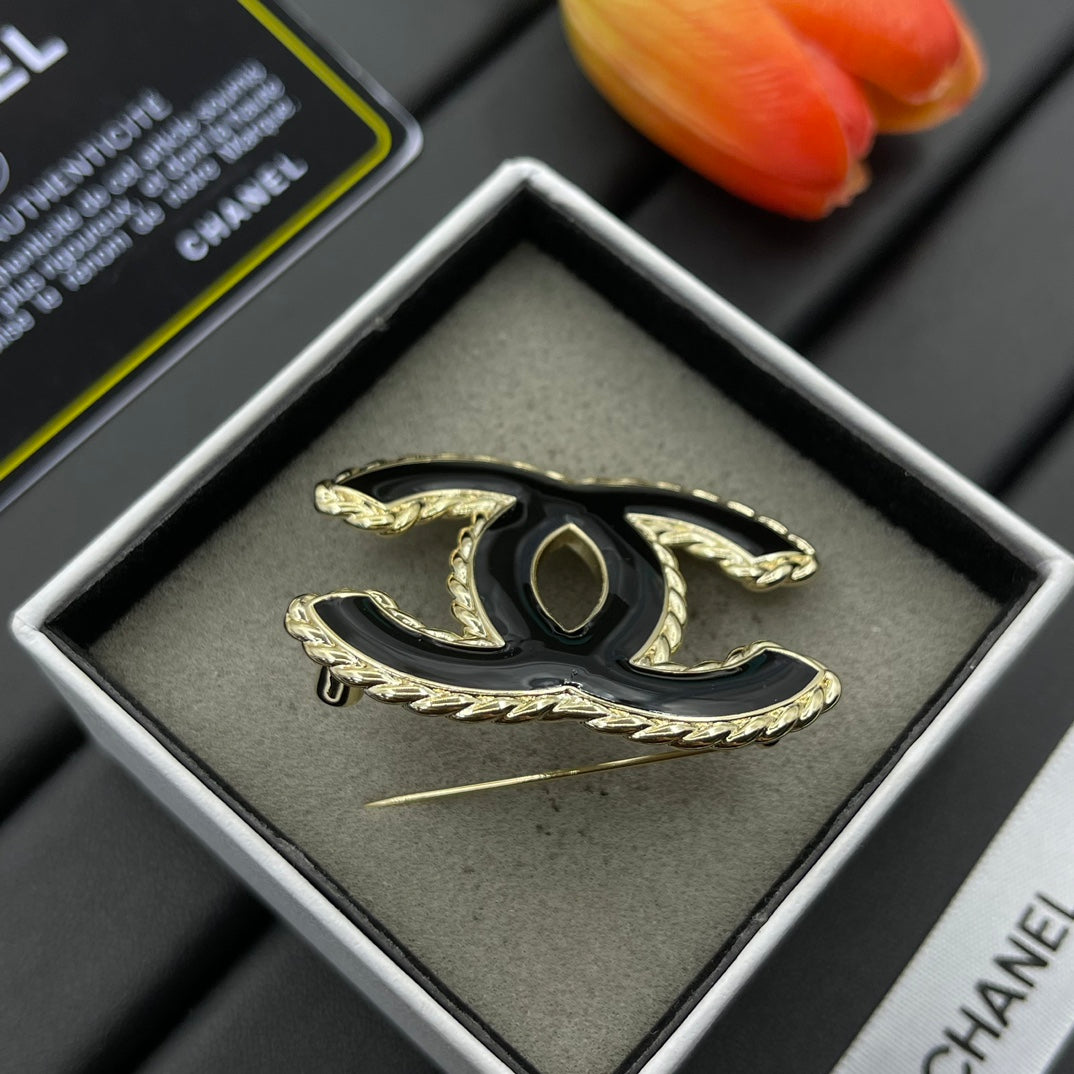 Black Enamel Brooch with Gold Setting