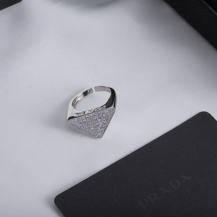 Triangle shaped ring with full diamonds