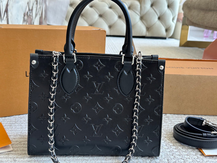 New black embossed handbag