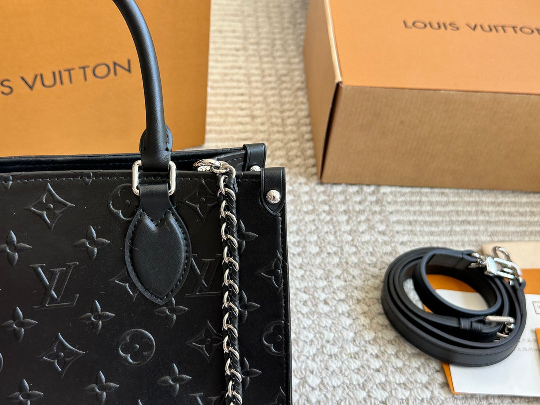 New black embossed handbag