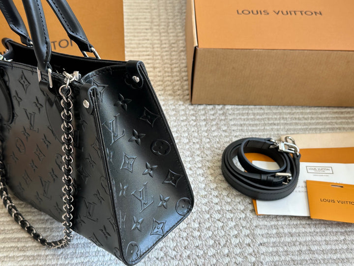 New black embossed handbag