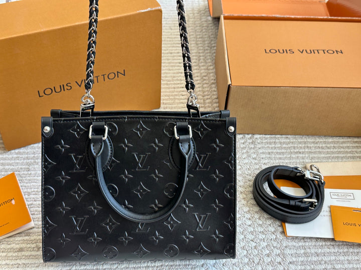New black embossed handbag