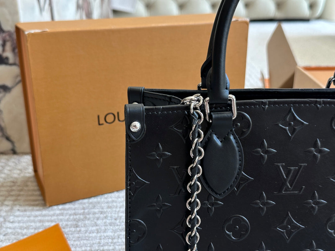 New black embossed handbag
