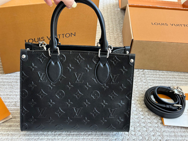 New black embossed handbag