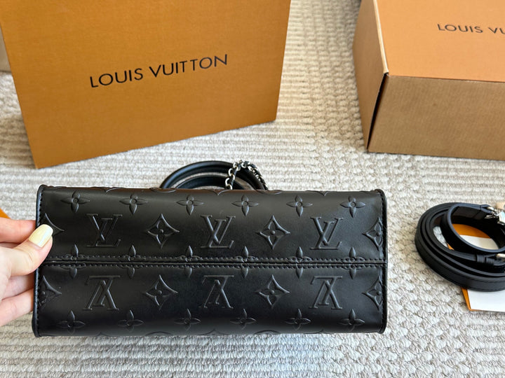 New black embossed handbag
