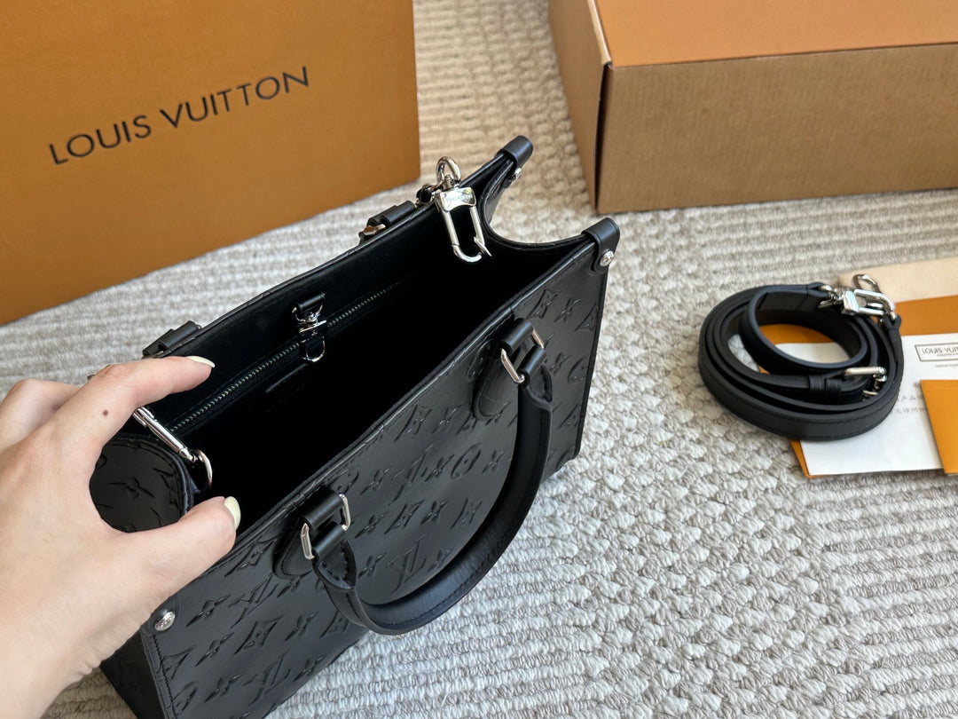 New black embossed handbag