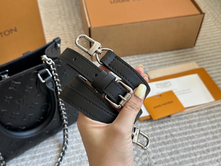 New black embossed handbag