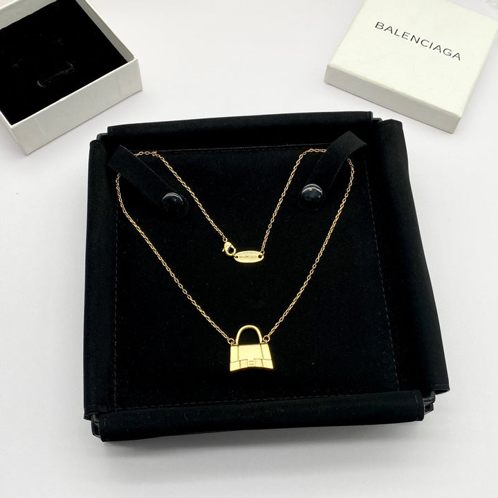 new gold bag pendant necklace