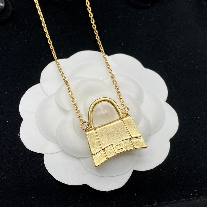 new gold bag pendant necklace