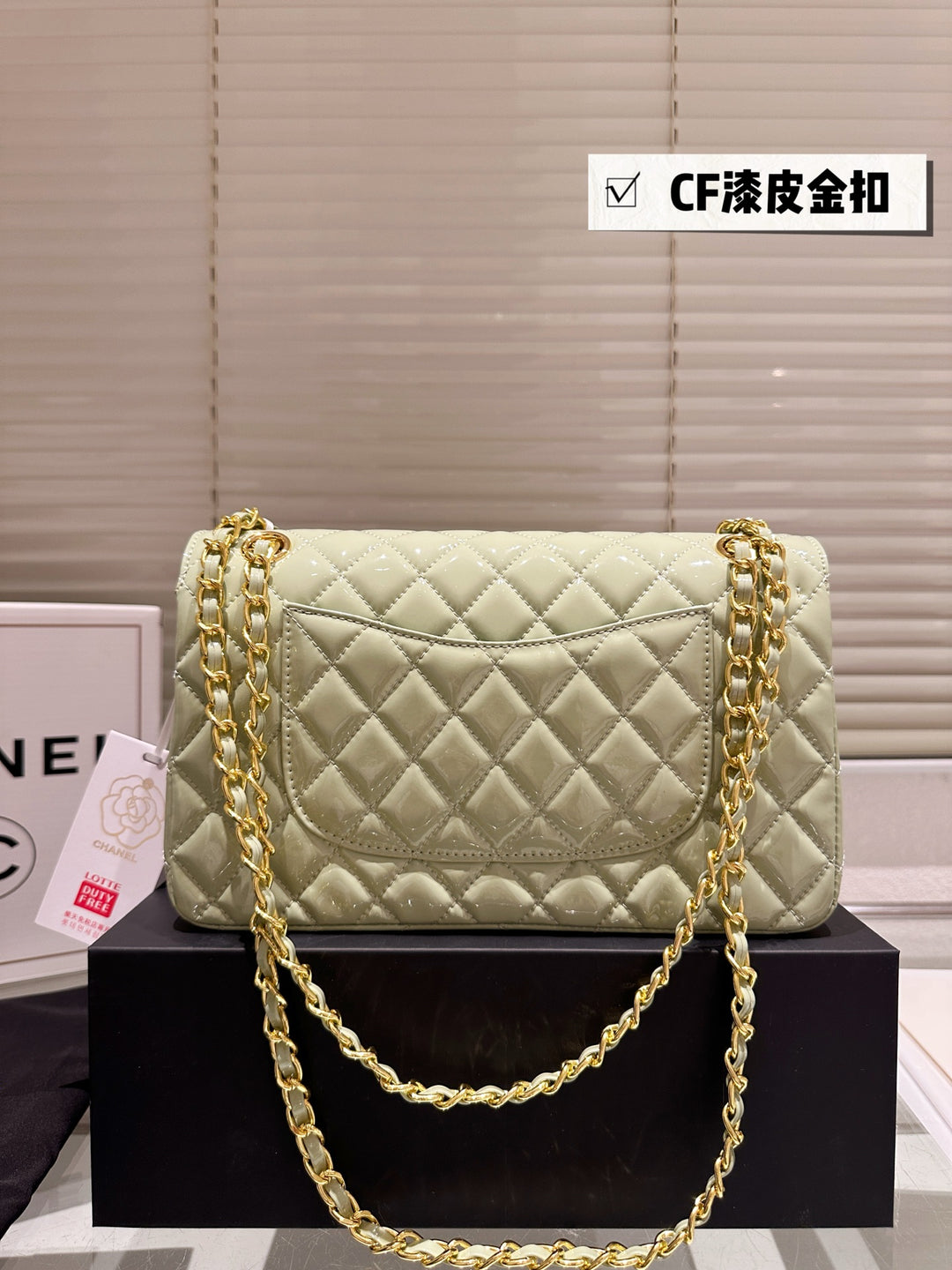 Two-tone light green quilted patent leather tote bag